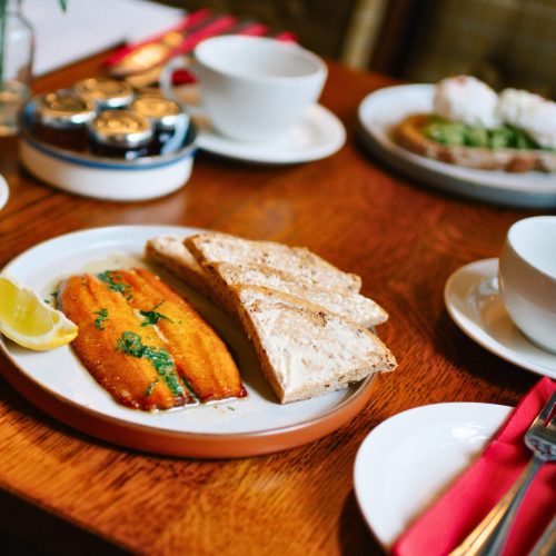 Salmon breakfast served in the dining room at the snooty fox hotel, tetbury